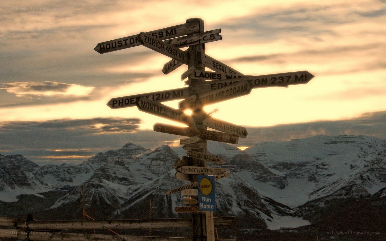 signpost with mountain view