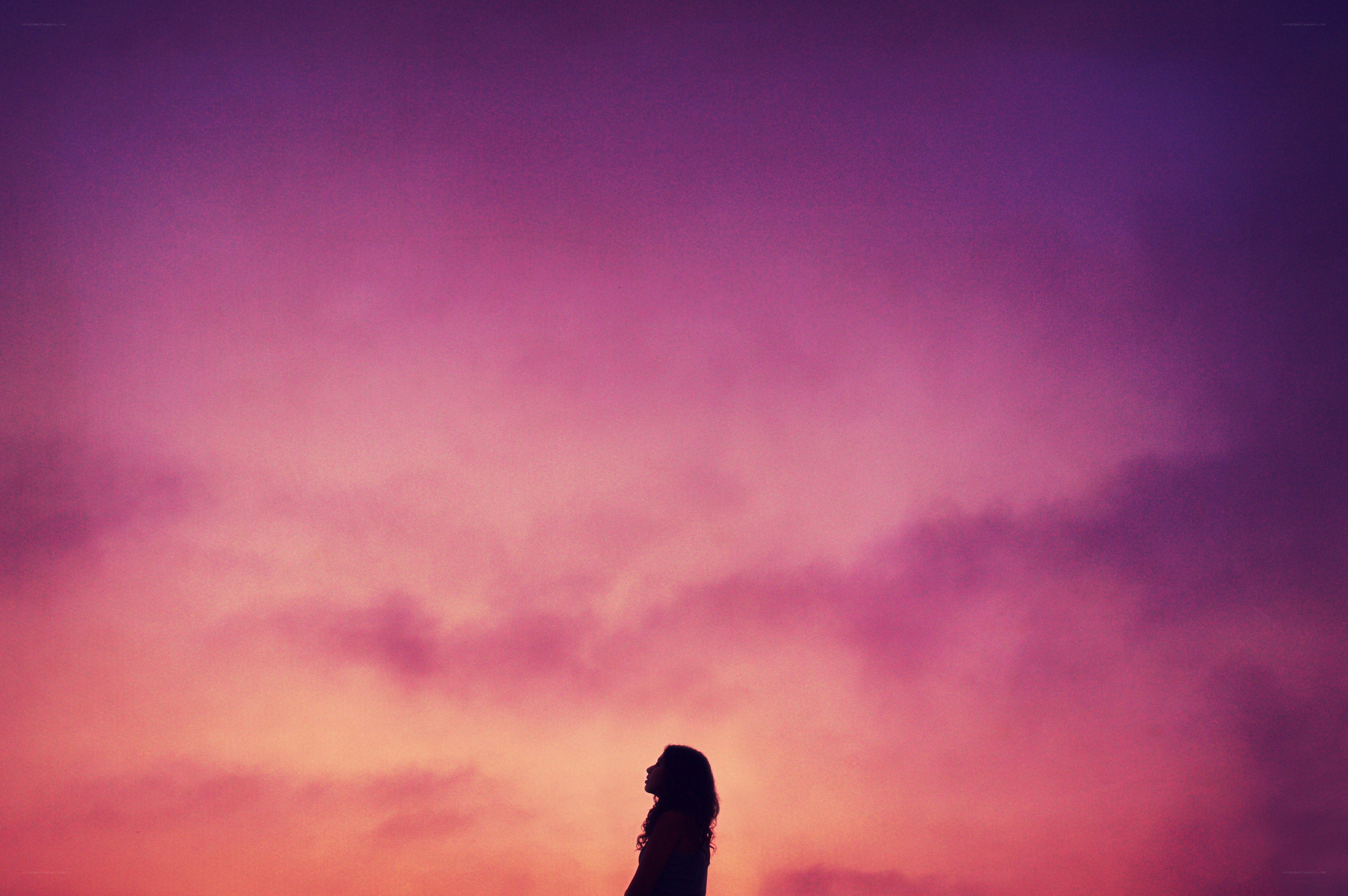 silhouette against a colorful sky
