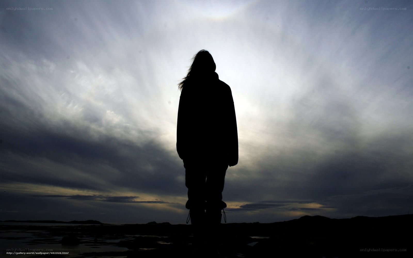 Silhouette against cloudy sky