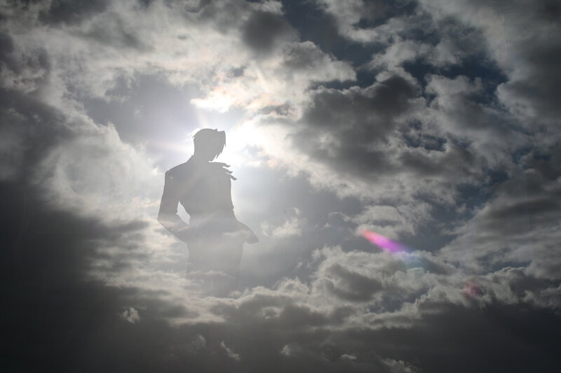 silhouette against cloudy sky