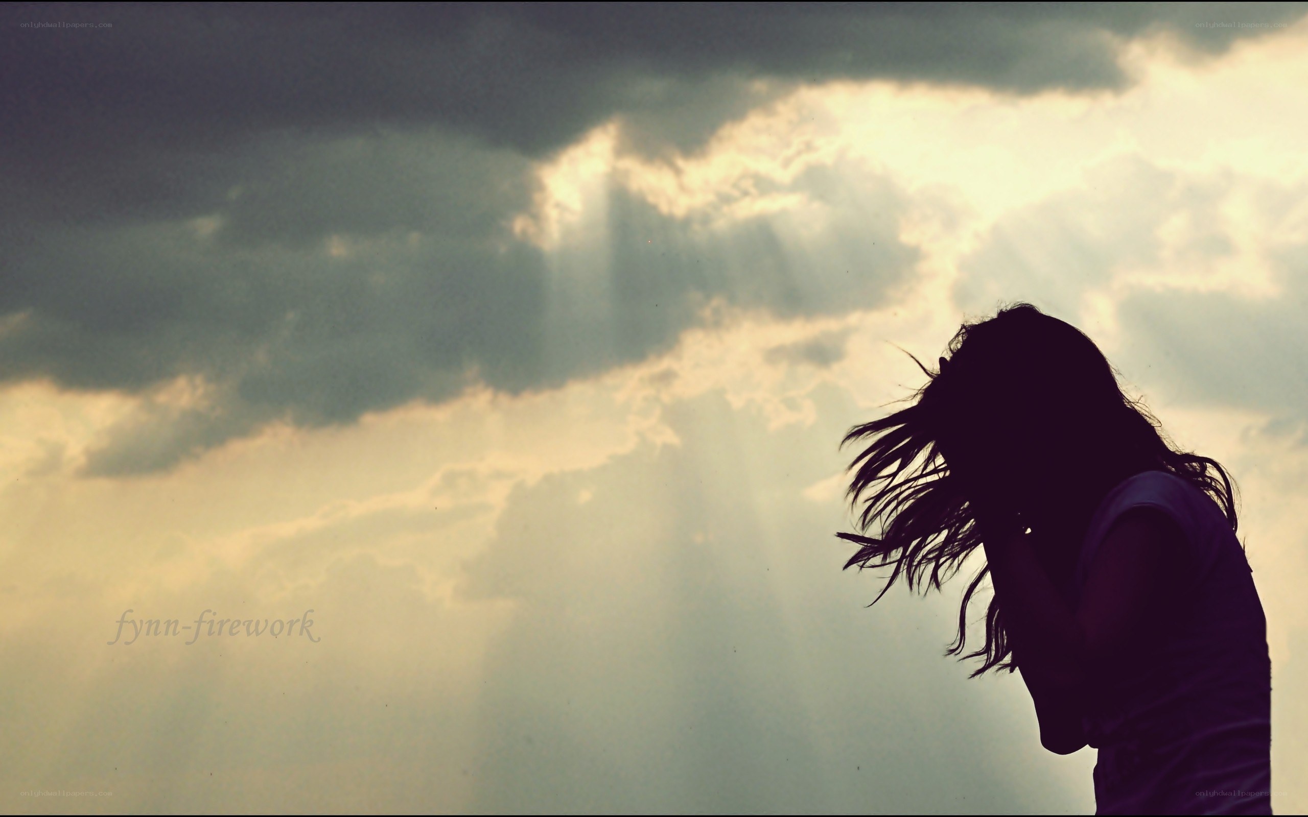 silhouette against sunbeams