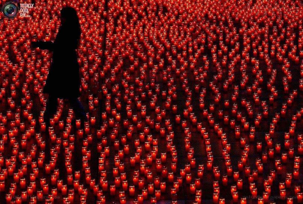 Silhouette among candles