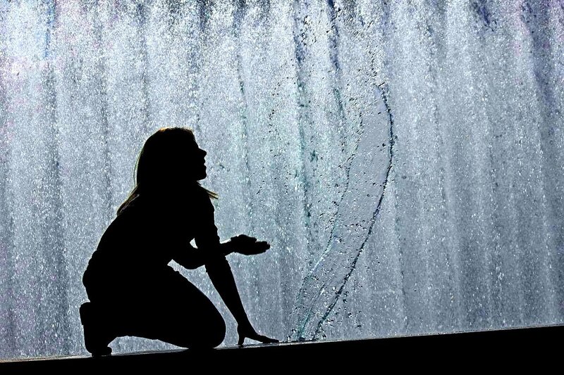 silhouette at a water fountain