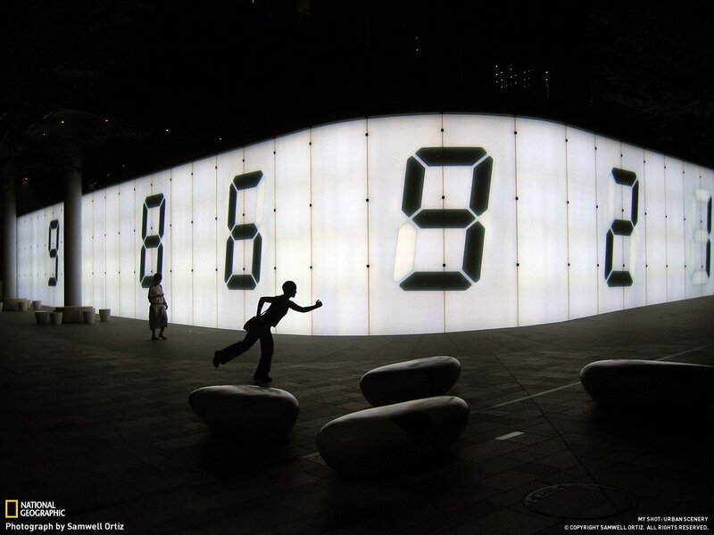 Silhouette at digital clock