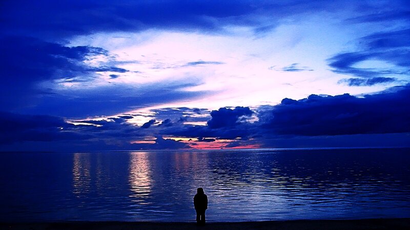 Silhouette at dusk by the sea