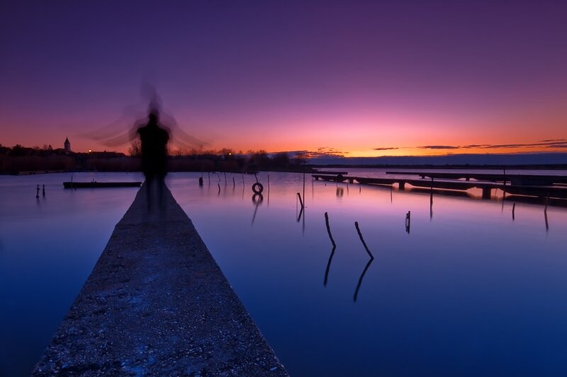 Silhouette at dusk on a pier