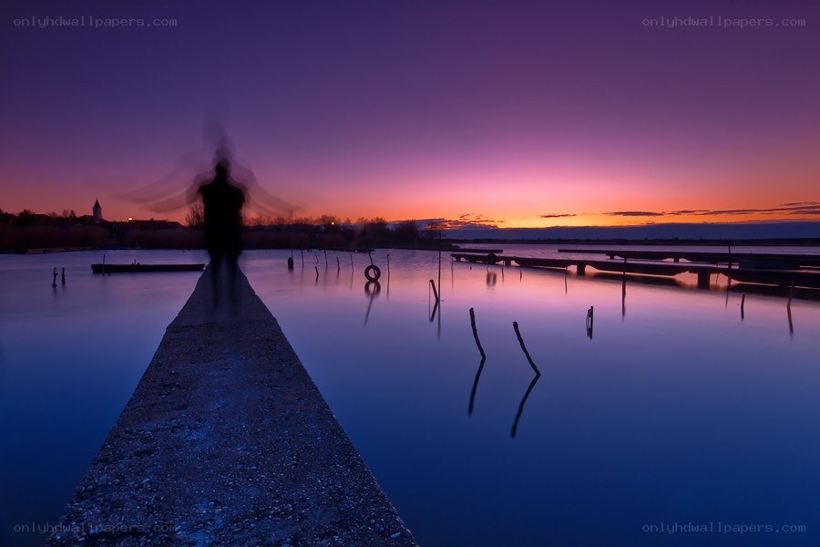 Silhouette at dusk on a pier