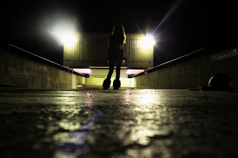 Silhouette at night in parking garage
