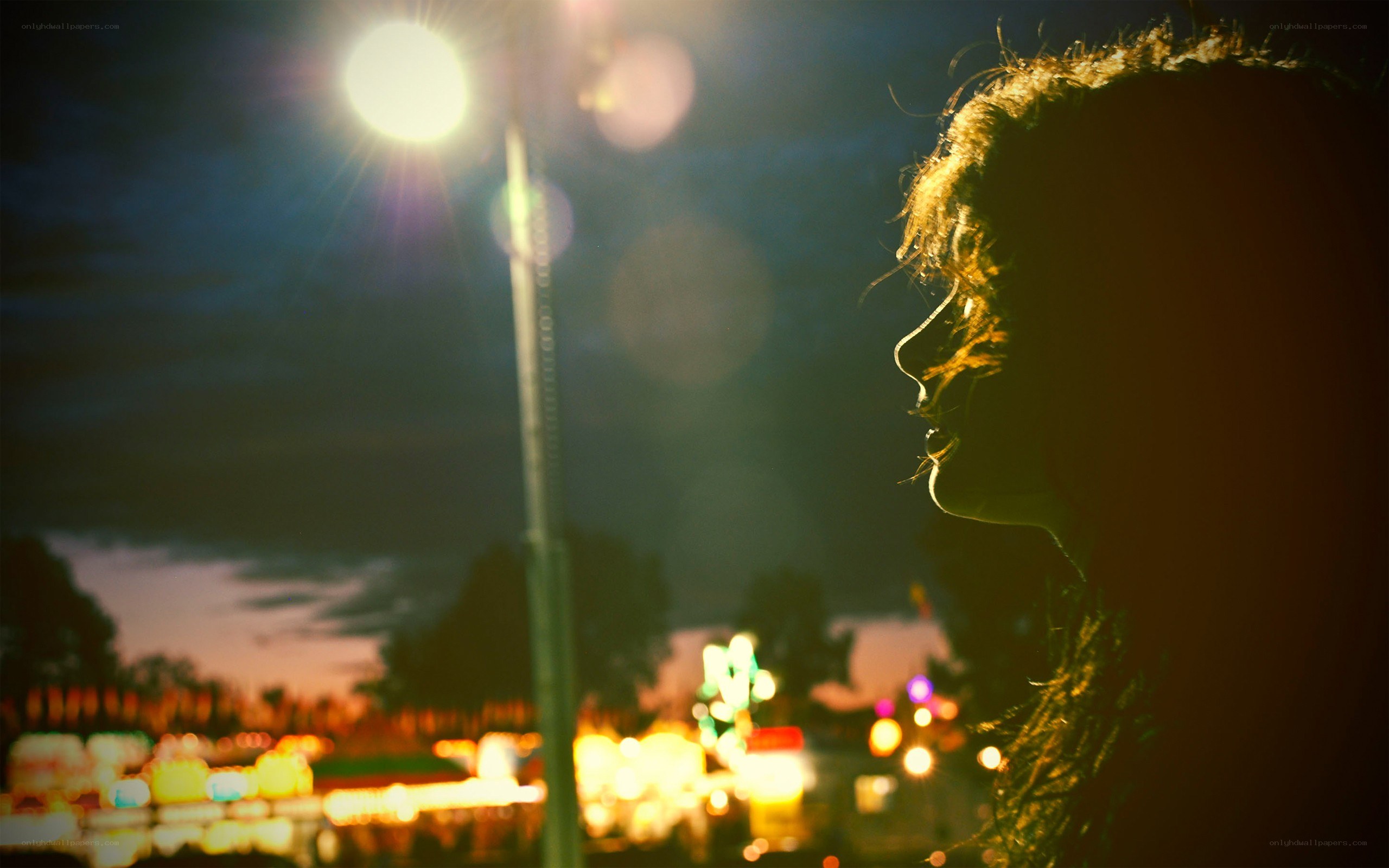 silhouette at night with lights