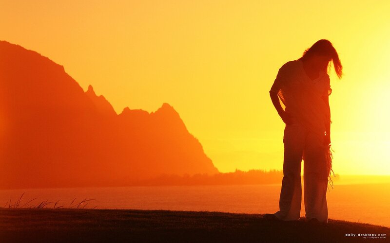 Silhouette at sunset by the sea