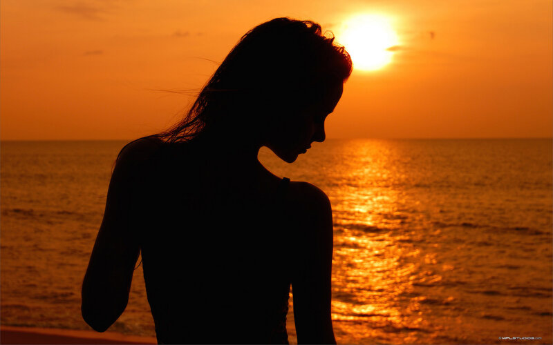 Silhouette at sunset by the sea