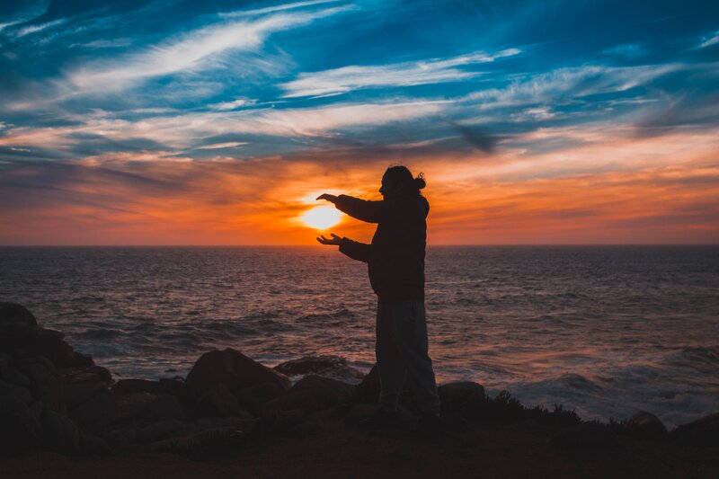 Silhouette at sunset by the sea