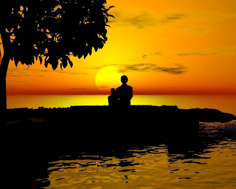 Silhouette at sunset by the water