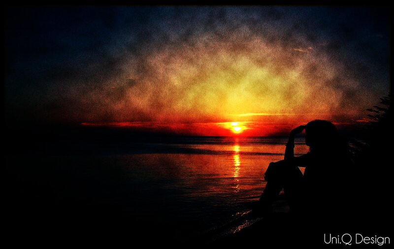 Silhouette at sunset by the water