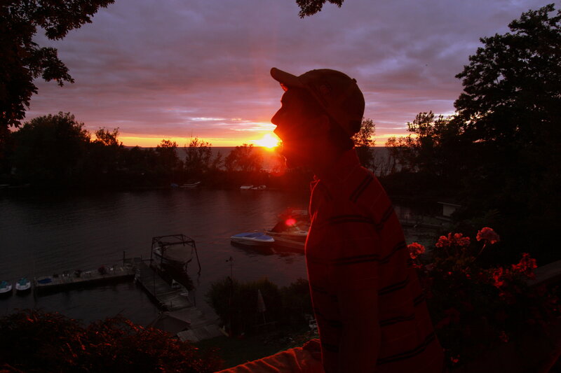 Silhouette at sunset by the water