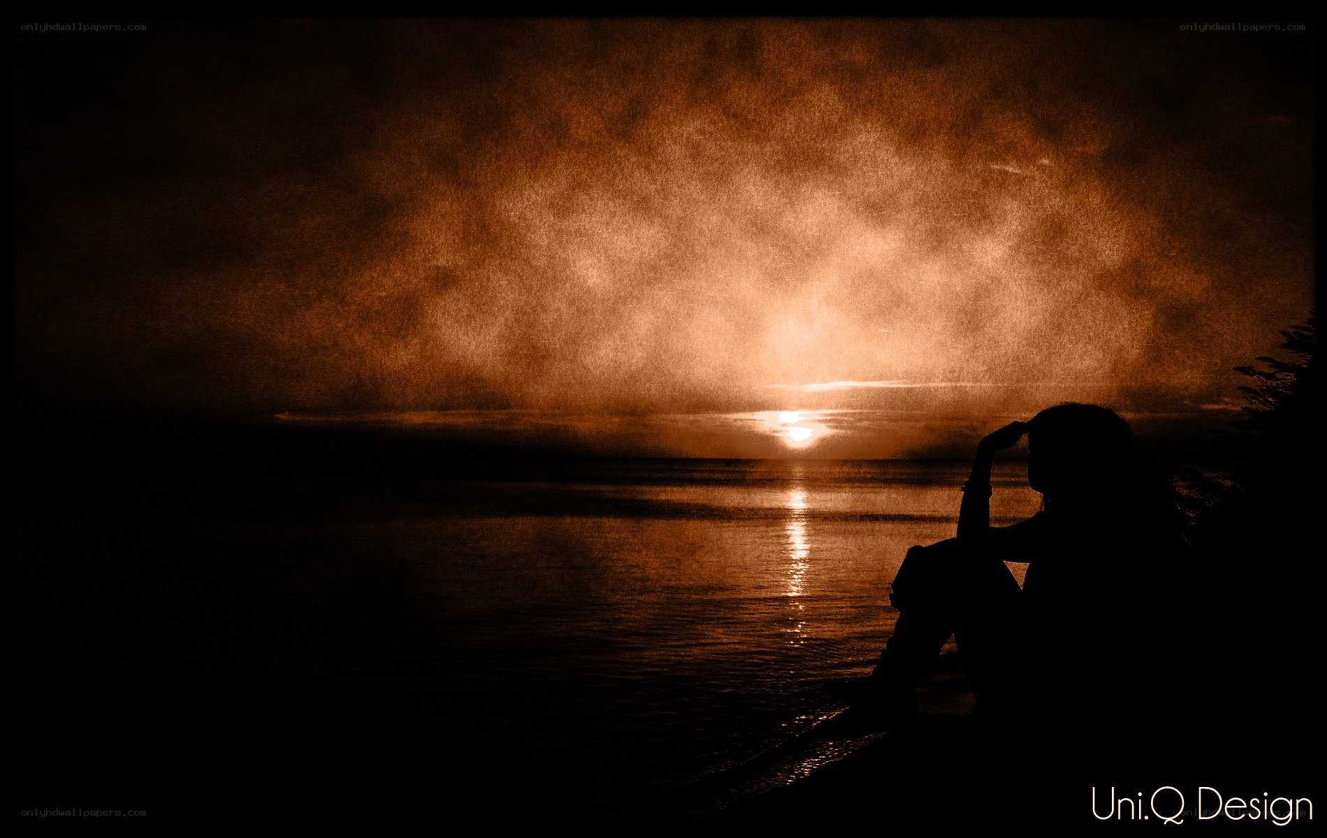 Silhouette at sunset by water