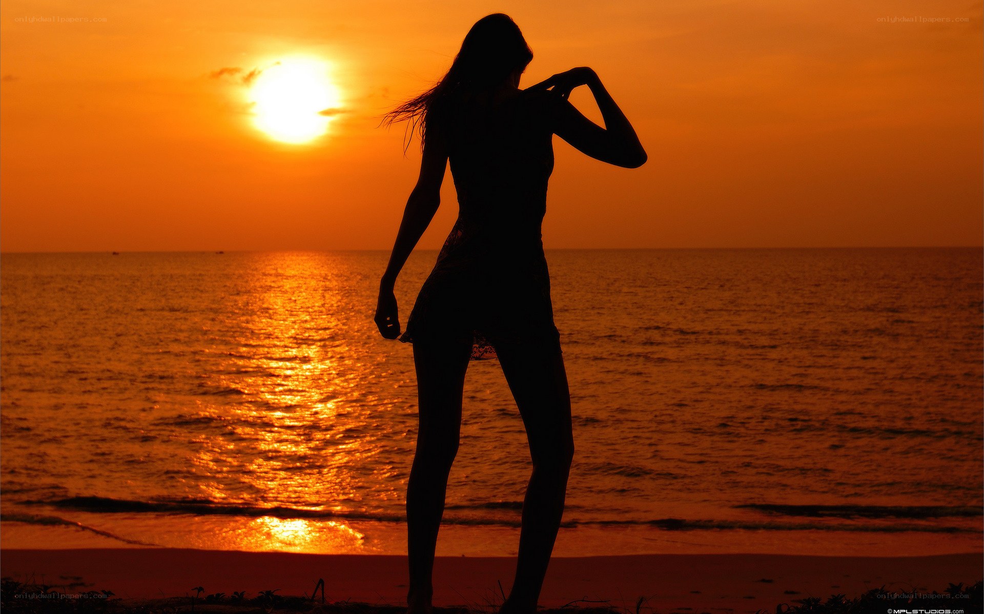 Silhouette at sunset on beach