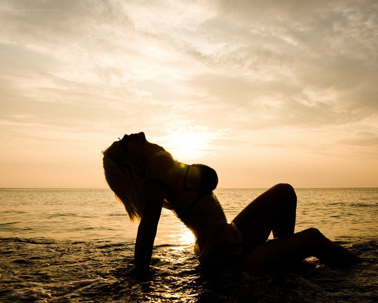 Silhouette at sunset on beach