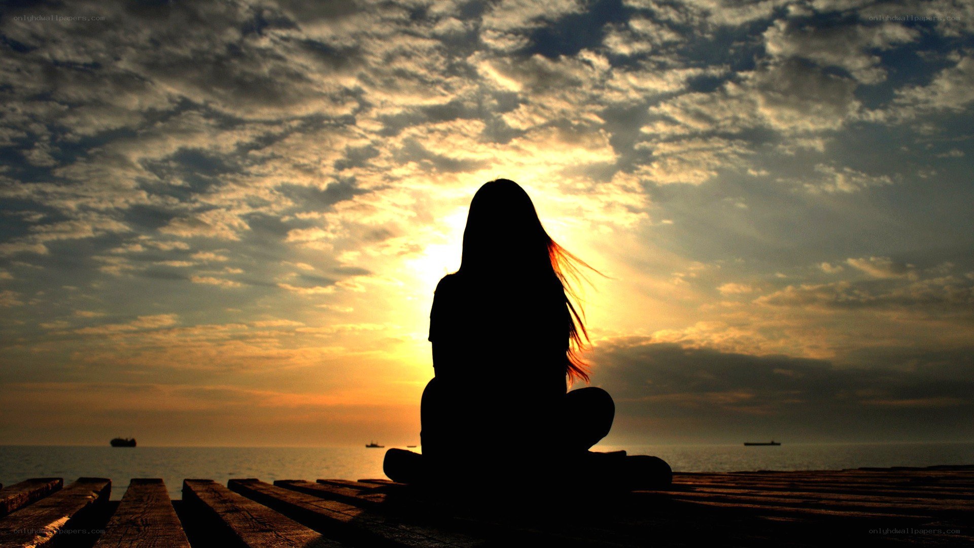 silhouette at sunset on dock