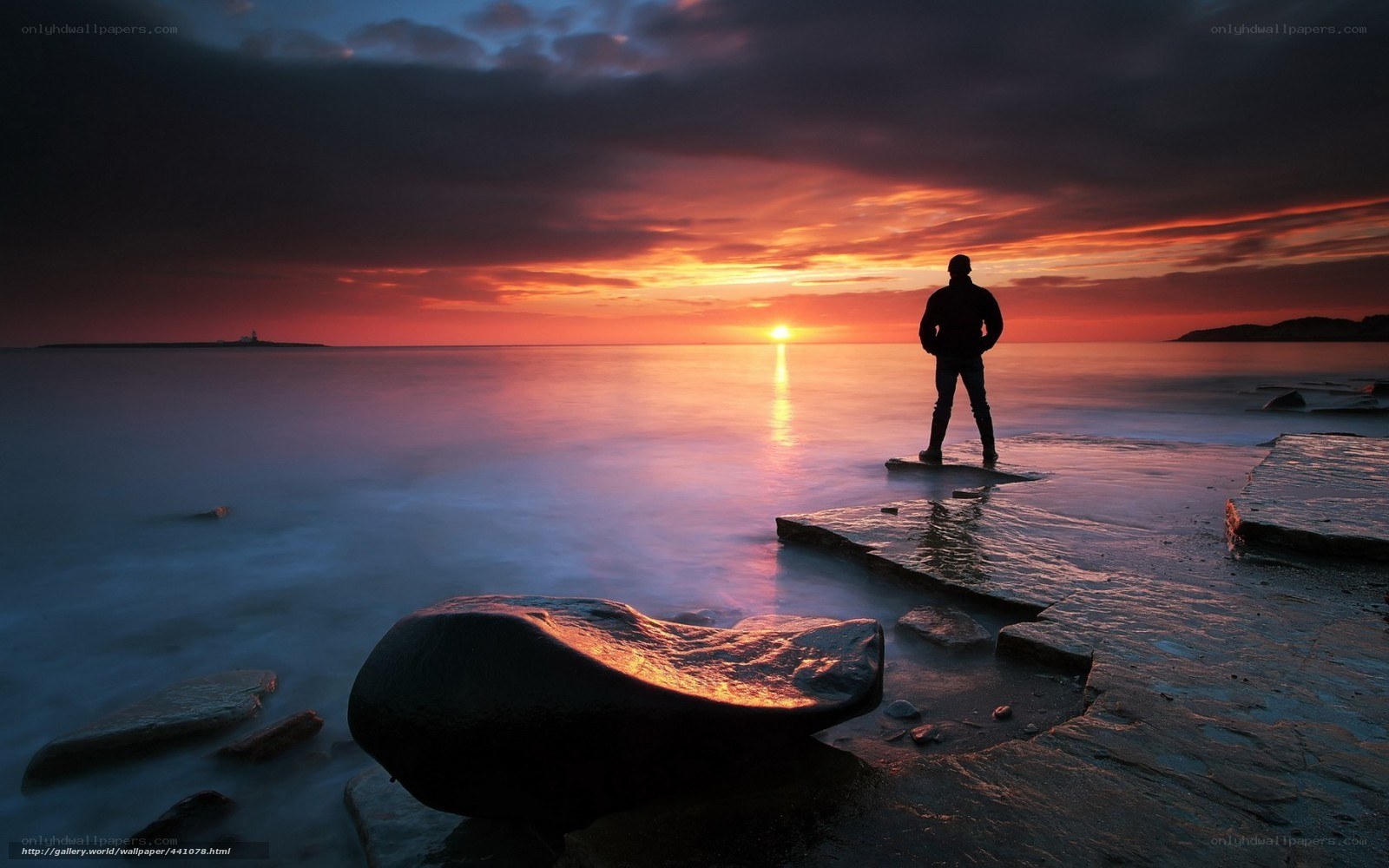 Silhouette at sunset on rocks