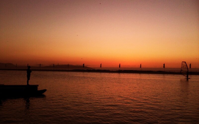Silhouette at sunset on the water