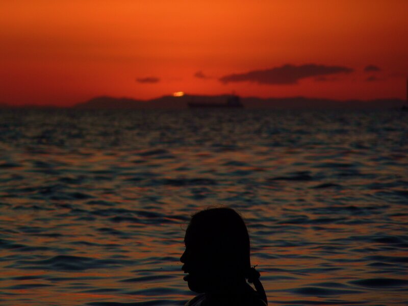 silhouette at sunset on water