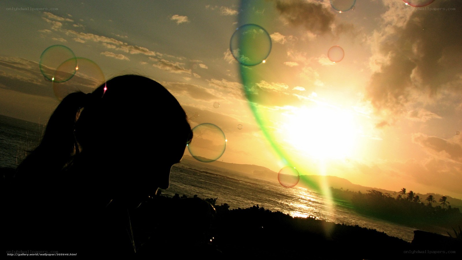 silhouette at sunset with bubbles