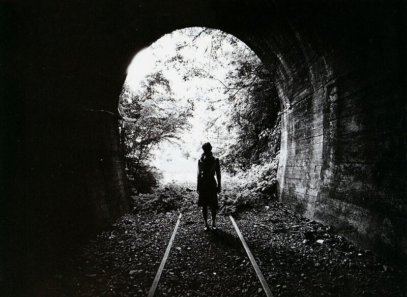 Silhouette at tunnel exit