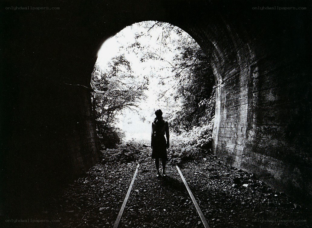 Silhouette at tunnel exit