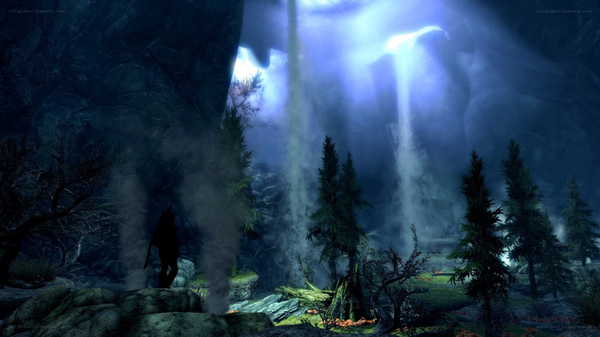silhouette at waterfall cave