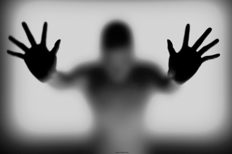 silhouette behind frosted glass