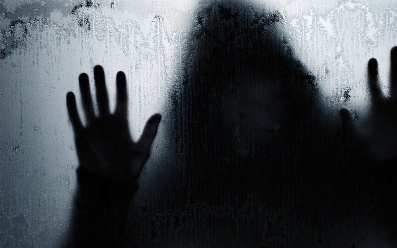 silhouette behind frosted glass