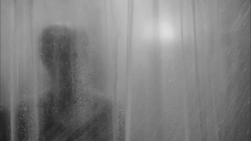 Silhouette Behind Shower Curtain