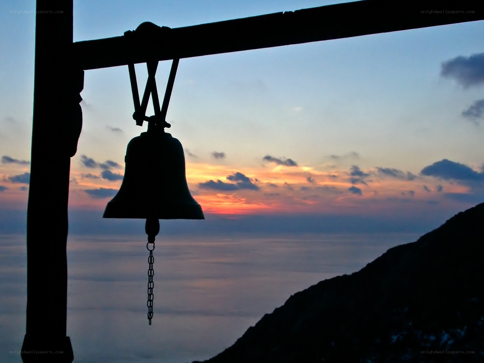 Silhouette bell at sunset