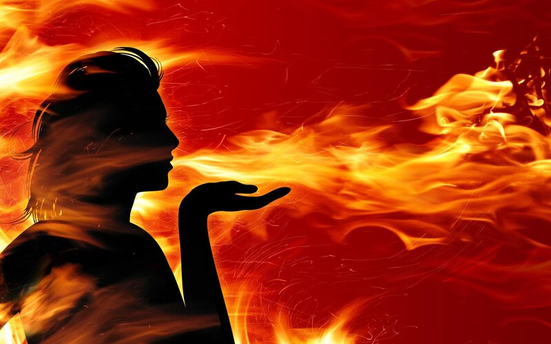silhouette blowing fire