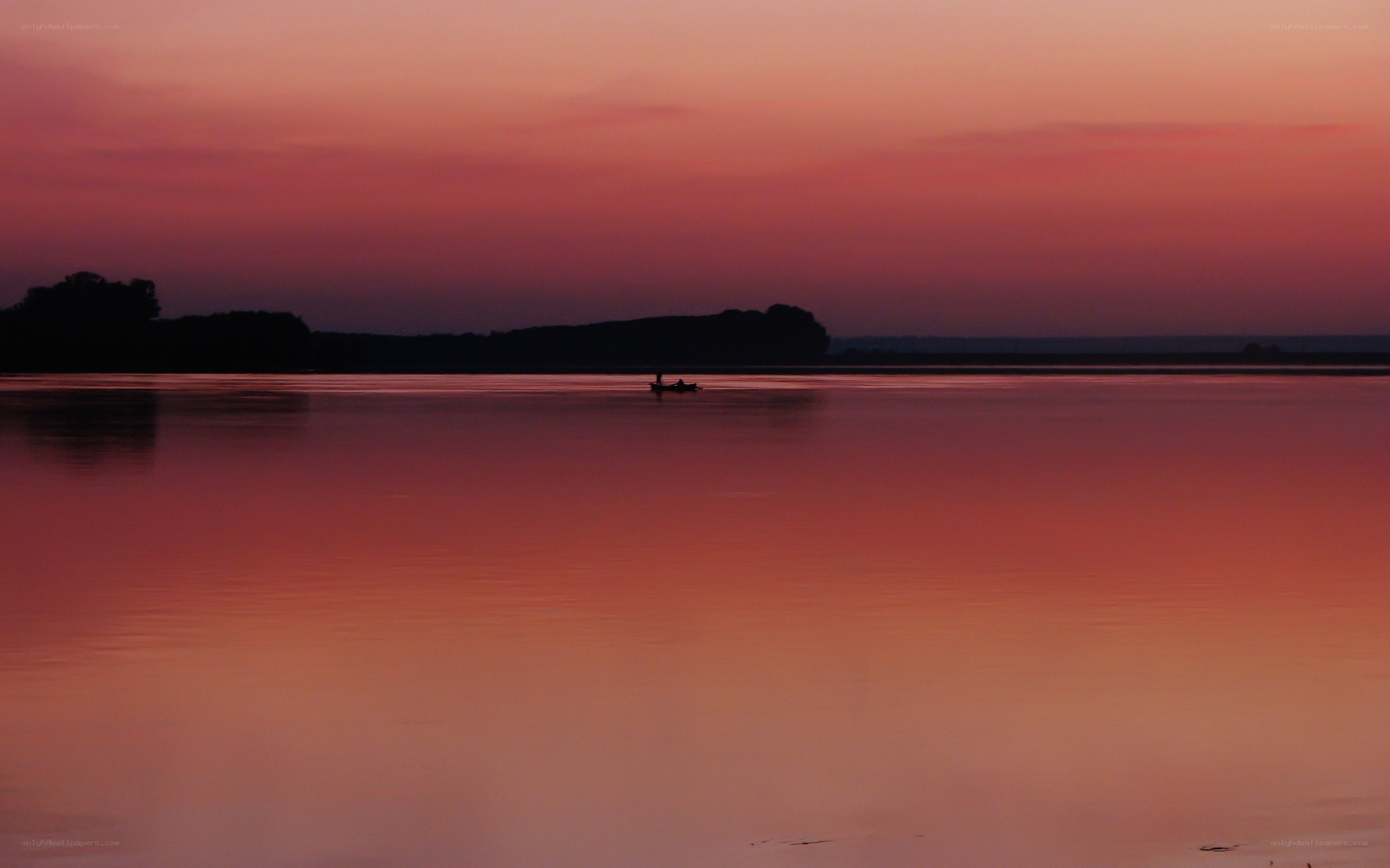Silhouette boat at sunset
