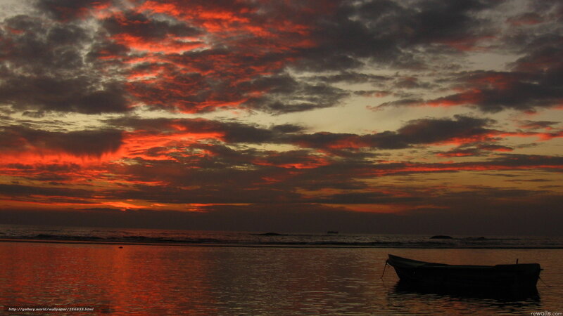 Silhouette Boat at Sunset — Red, Dramatic