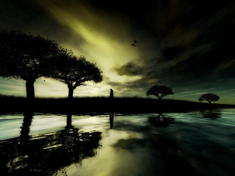 Silhouette by the water at dusk