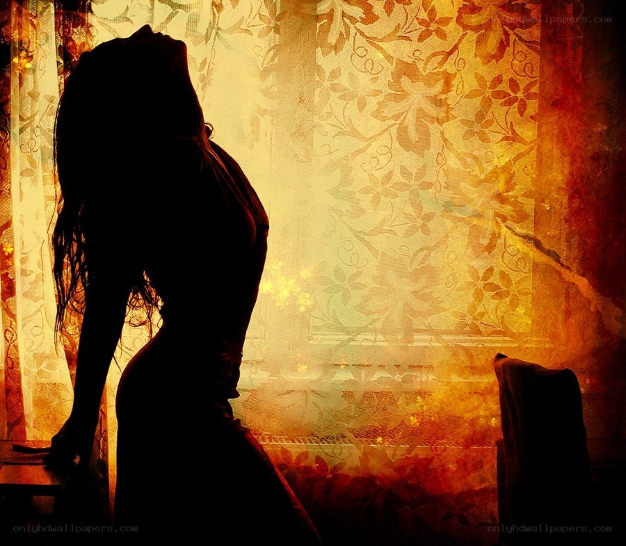 silhouette by window at sunset