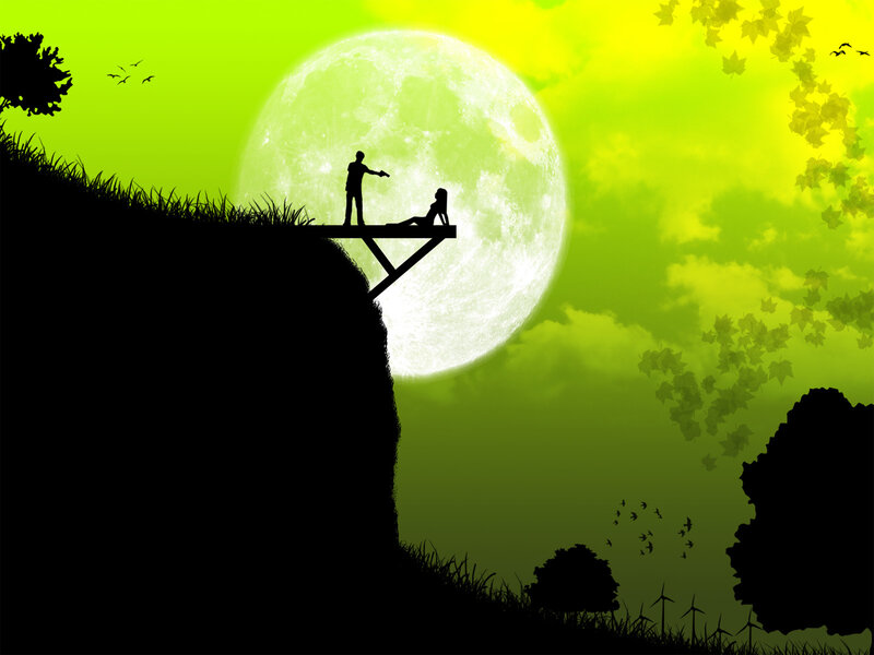 Silhouette couple on cliff