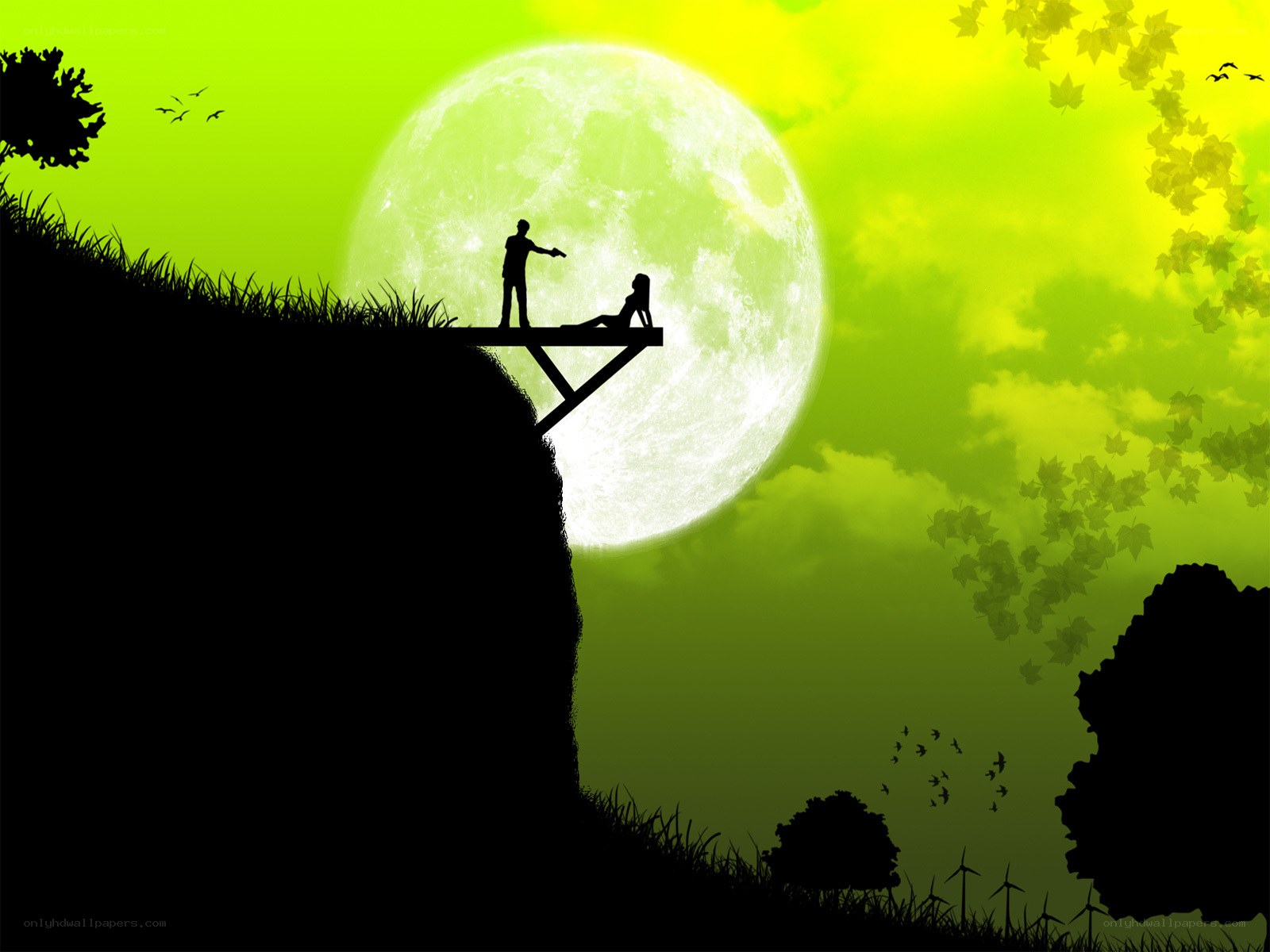Silhouette couple on cliff