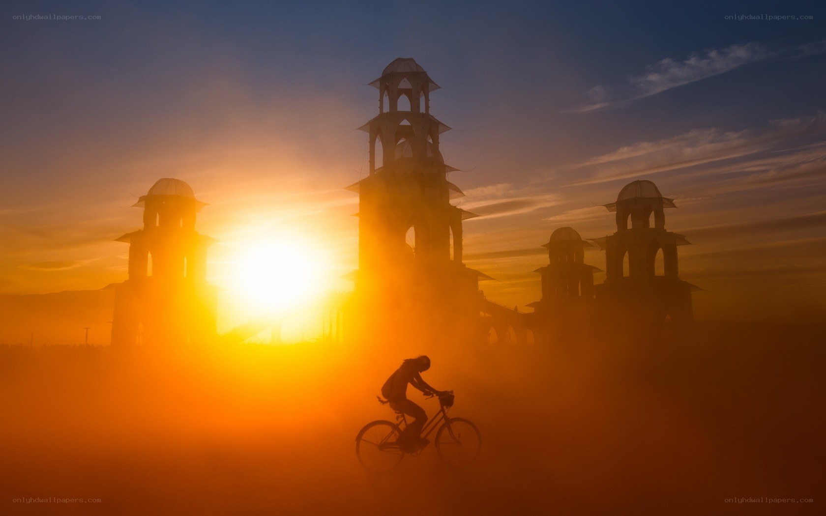 Silhouette cyclist at sunset