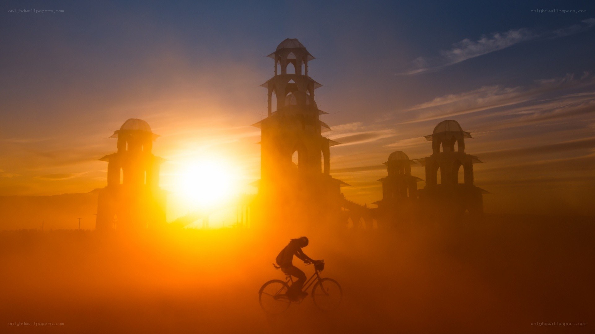 Silhouette cyclist at sunset