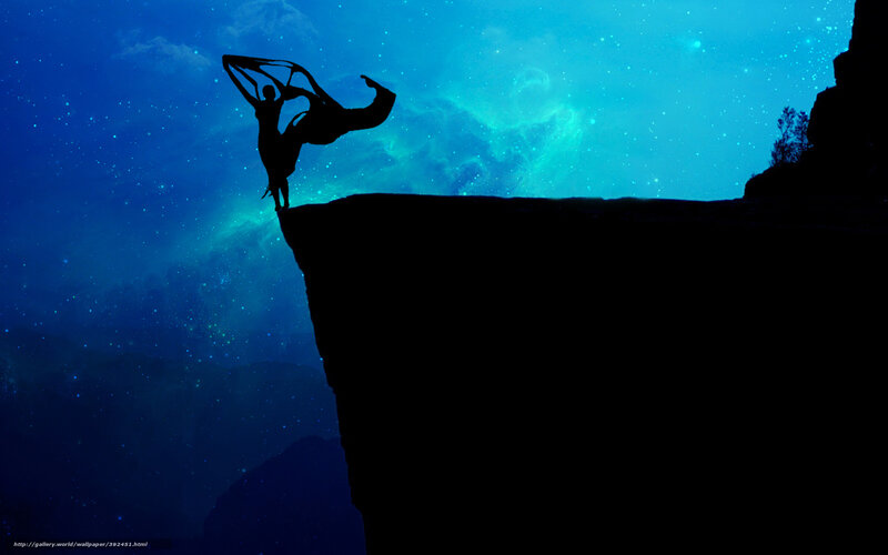 Silhouette dancer on cliff