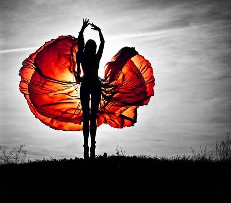 Silhouette Dancer with Red Fabric