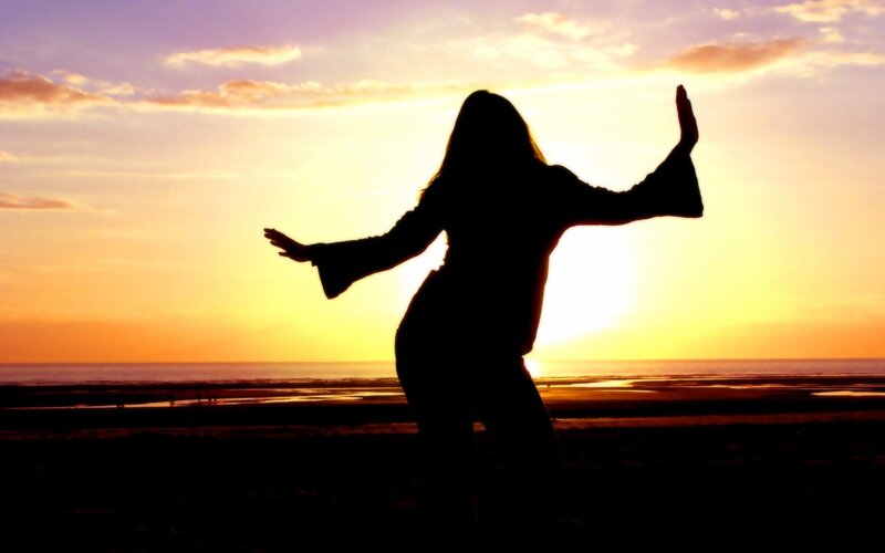 Silhouette dancing at sunset