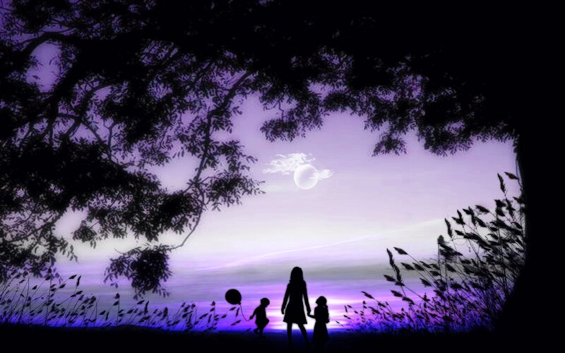 Silhouette family under moonlight