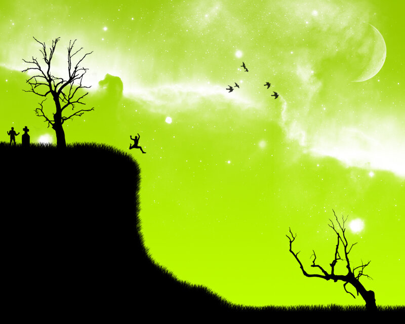 Silhouette figures on a cliff