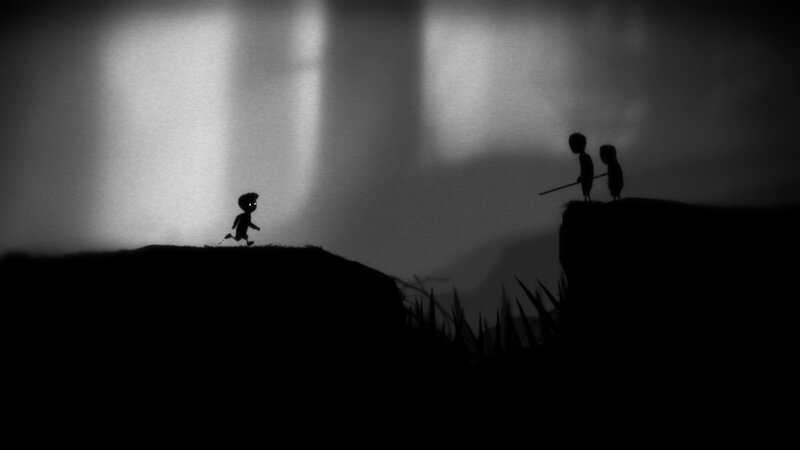 Silhouette figures on a cliff