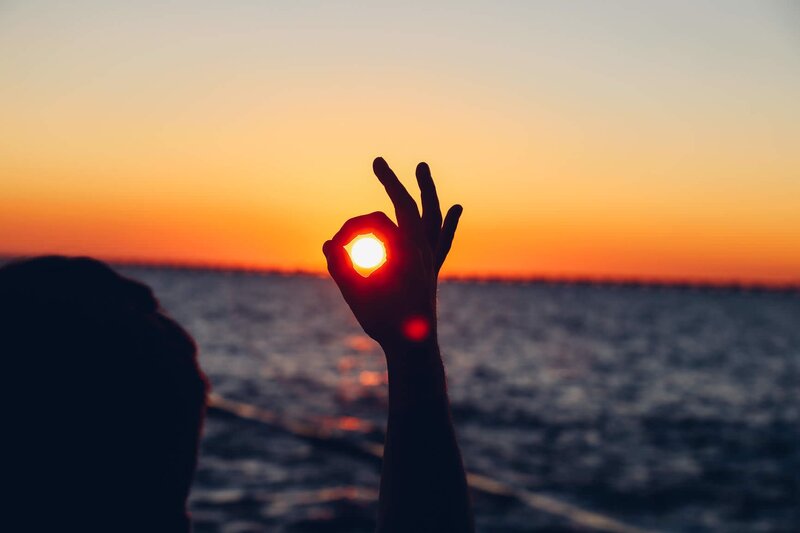 Silhouette Hand Holding Sun